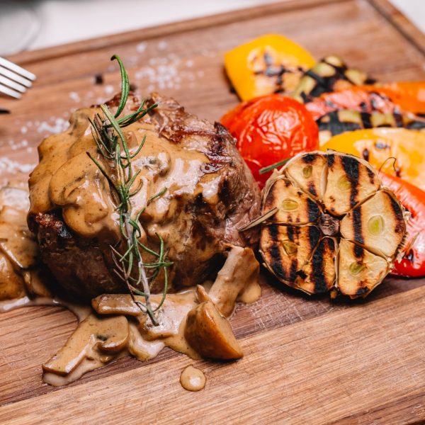 side-view-steak-medallion-mushroom-sauce-grilled-vegetables